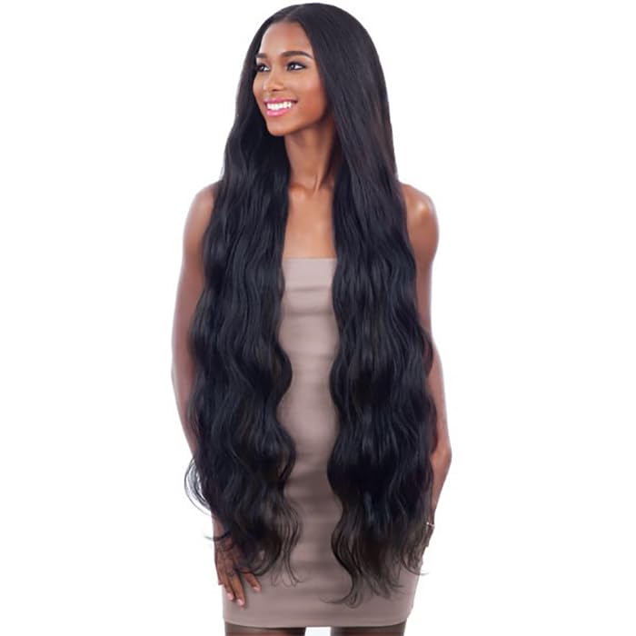 Model wearing Organique Mastermix Body Wave 30 inch synthetic weave in off black, loose waves falling past the hips